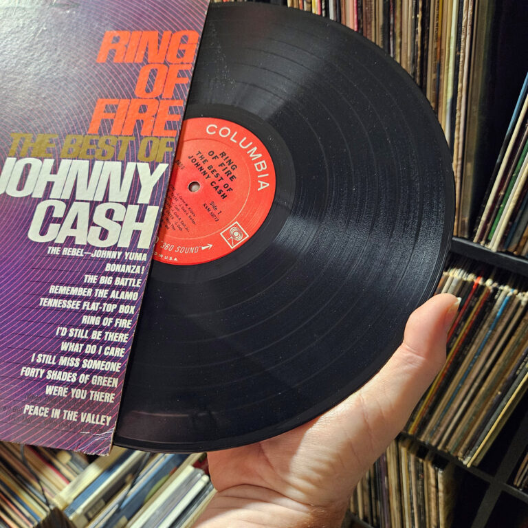Proper handling of a vinyl record using the edge and center label