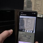Hand scanning a CD barcode with the M Media UPC Scanner app on an Android phone